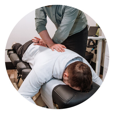 Adult getting adjusted by chiropractor for wellness Chiropractic Care